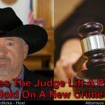 Charged with new crime? Will Judge lift a probation hold?